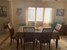 Dining space featuring light tile patterned floors, ornamental molding, and ceiling fan