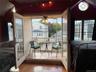 Sunroom featuring vaulted ceiling