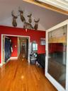 Bedroom featuring vaulted ceiling, wood finished floors, and a closet