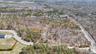 Birds eye view of property with a view of trees