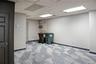 Basement with light carpet and a paneled ceiling