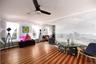 Sitting room with a ceiling fan, crown molding, wood finished floors, and a baseboard heating unit
