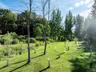 View of home's community featuring a lawn, a view of countryside, and a view of trees