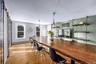 Dining room featuring light wood-type flooring and a baseboard heating unit