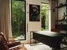 Guest room 3 or home office with floor to ceiling windows overlooking the backyard.