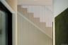 Steel rod waterfall wall staircase.