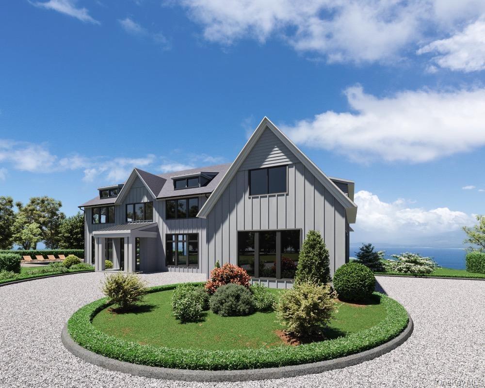 Back of property featuring board and batten siding and curved driveway
