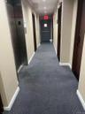Hall featuring carpet and elevator