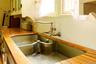 Kitchen view of butcher block countertops and a sink