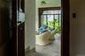 Doorway with stone tile floors and a ceiling fan