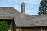 Exterior view of stone siding and a chimney