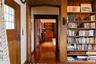Hallway featuring dark wood-style flooring