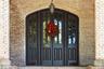 Property entrance featuring brick siding