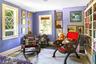 Living area with ornamental molding, baseboards, and wood finished floors