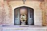 Property entrance with brick siding