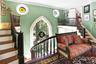 Staircase featuring crown molding, baseboards, and wood finished floors