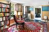Sitting room with radiator heating unit, baseboards, and wood finished floors