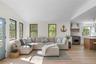 Living room featuring lofted ceiling and light wood-style floors