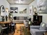 Living room with crown molding and wood finished floors