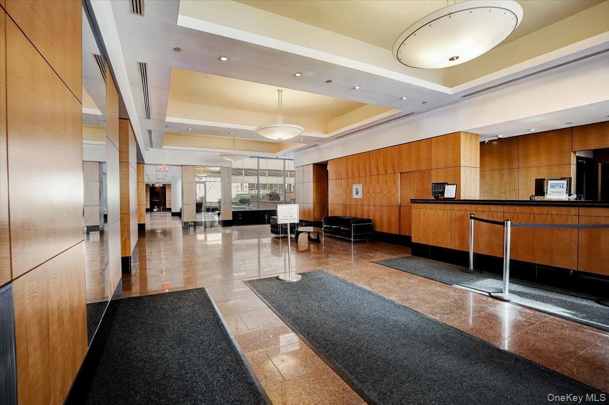 Common area featuring recessed lighting and wood walls
