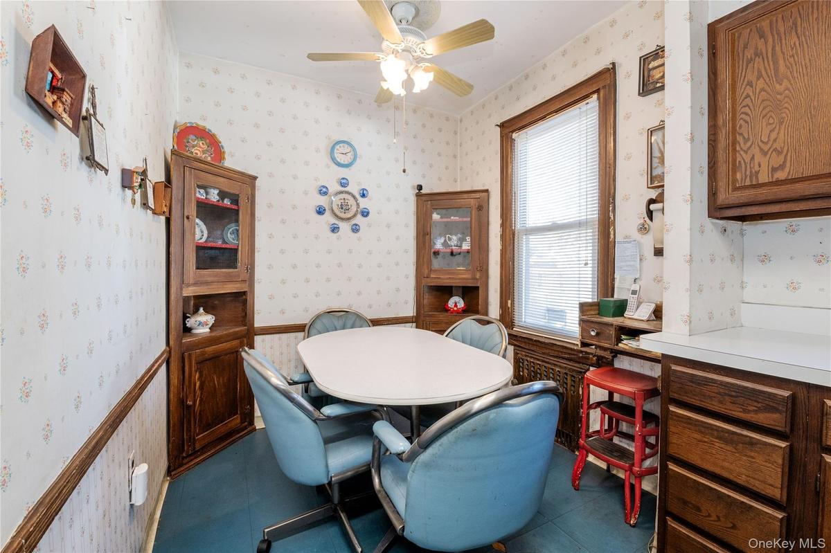 Dining space off kitchen with ceiling fan