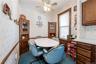 Dining space off kitchen with ceiling fan