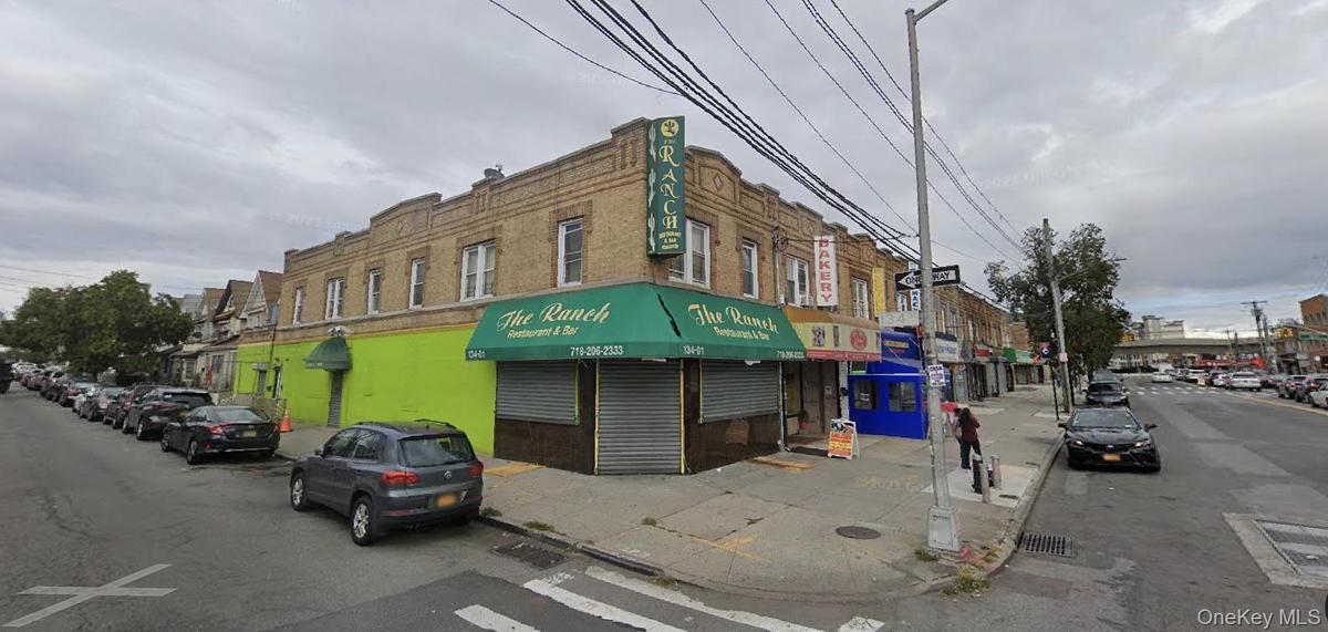 View of commercial property, 2 side entrances (1 for tenants and 1 side entry to the bar). Thriving businesses nearby.