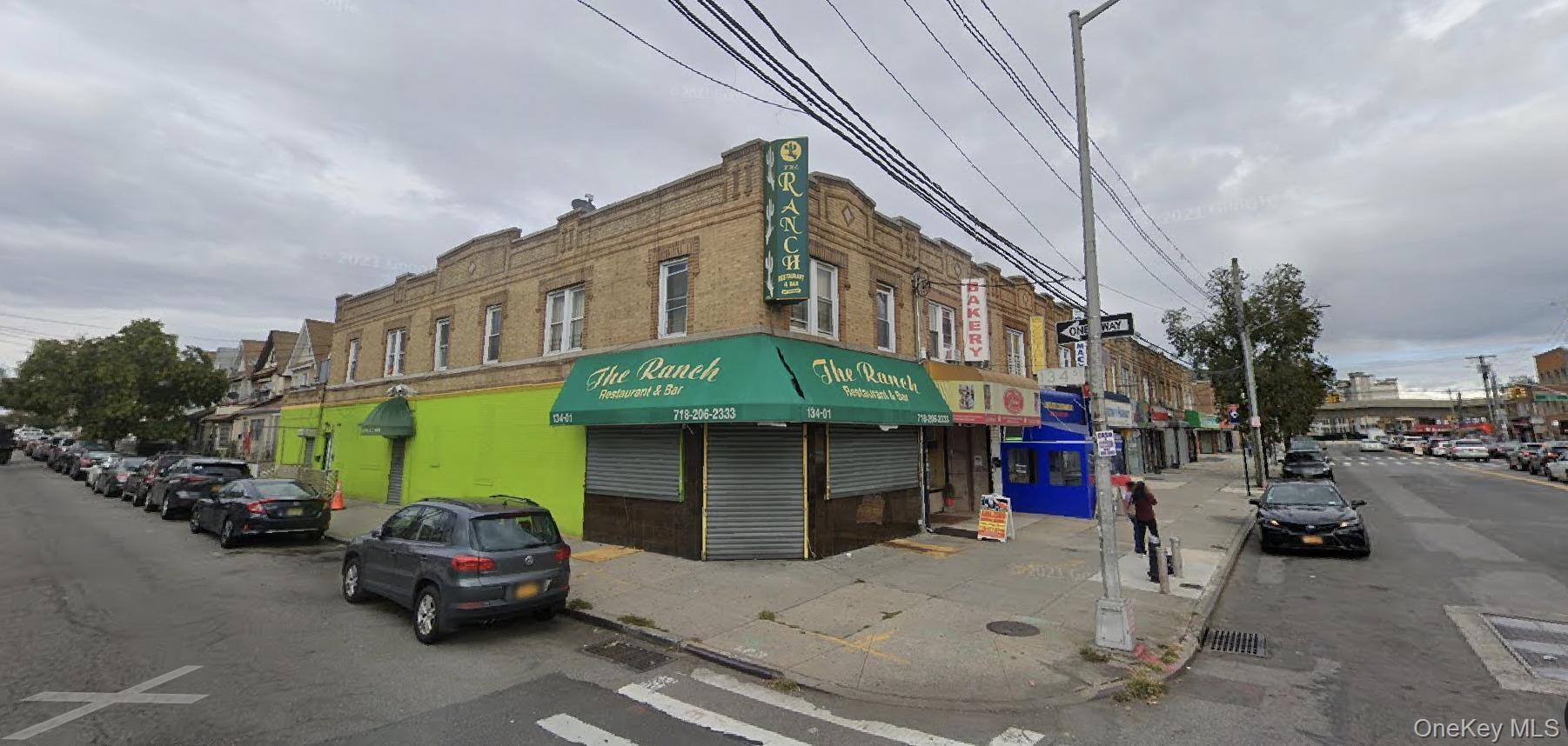 View of commercial property, 2 side entrances (1 for tenants and 1 side entry to the bar). Thriving businesses nearby.