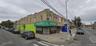 View of commercial property, 2 side entrances (1 for tenants and 1 side entry to the bar). Thriving businesses nearby.