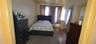 Bedroom featuring dark wood finished floors