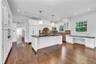 Large Granite Kitchen with Fireplace and Entrance to Both Front and Rear Yards...Plus Amazing Waterviews!