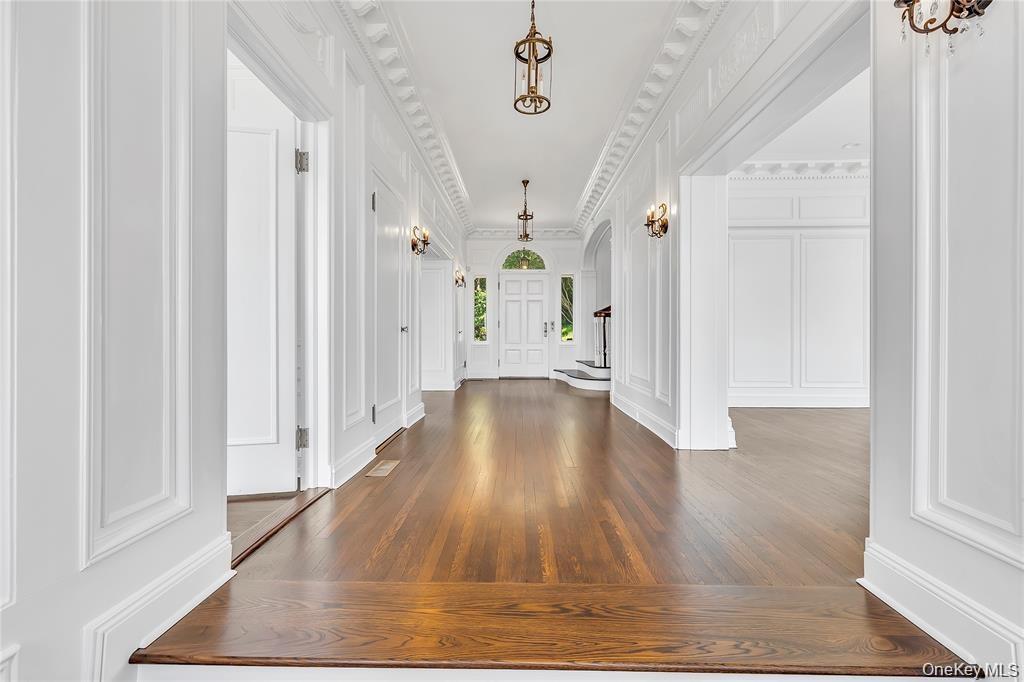 The Front to Back Center Hall Provides a Formal Transition to The Private Rooms that Flank it on Either Side