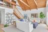 Open plan living and dining with soaring ceilings and views