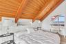Upper level bedroom with private bath, balcony and water views
