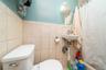 Bathroom featuring a shower with shower curtain and tile walls