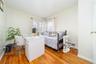 Bedroom with light wood-type flooring and a desk