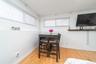 Dining space with light wood-style floors and baseboards