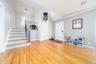 Foyer featuring light wood-style floors and lofted ceiling