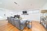 Living area with light wood-style floors, plenty of natural light, and recessed lighting
