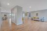 Living room featuring light wood finished floors and recessed lighting
