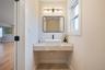Bathroom with healthy amount of natural light and wood finished floors