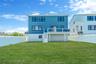Back of house featuring stairway and stucco siding