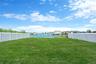 View of yard with a water view