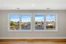 Unfurnished room with a water view, baseboards, wood finished floors, and recessed lighting