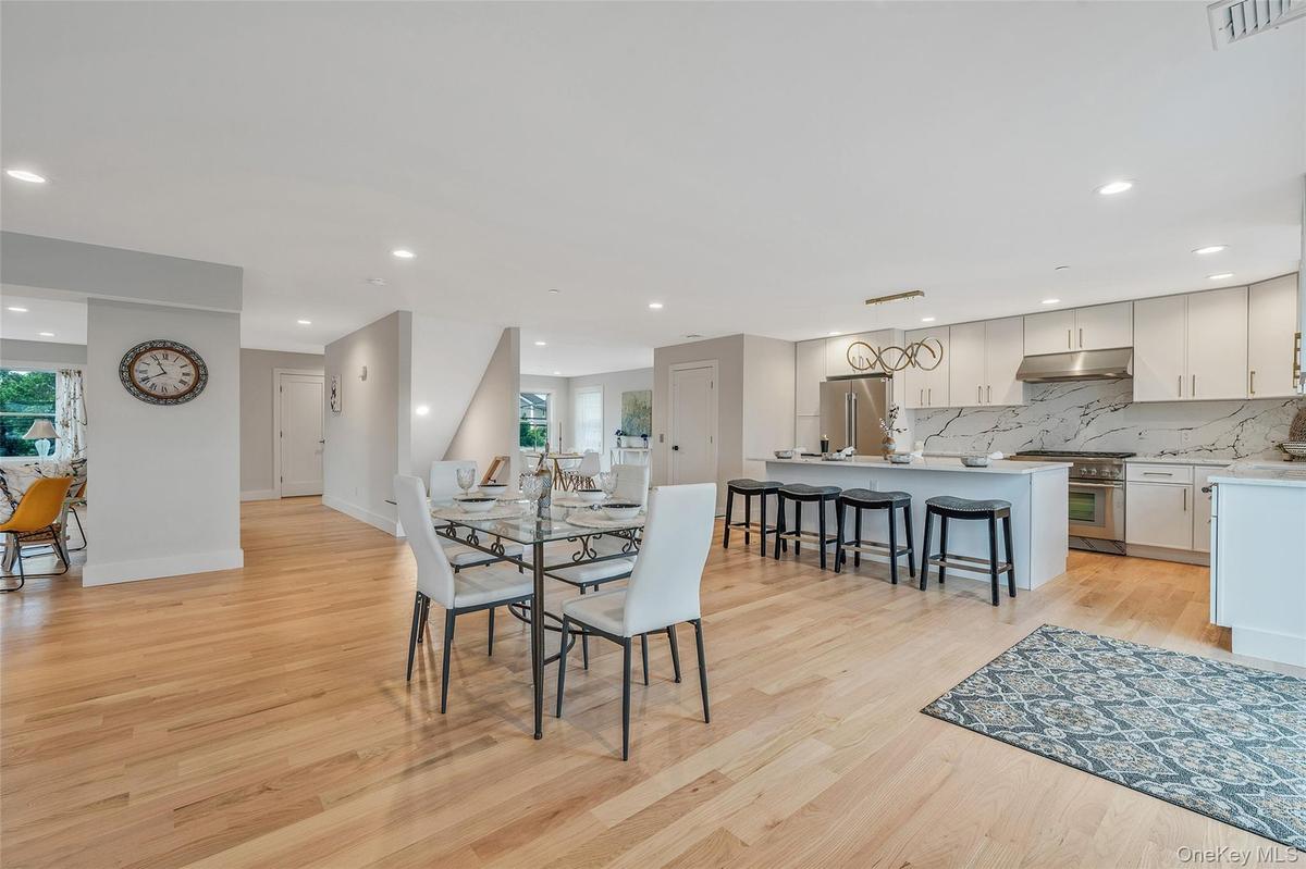 Dining space featuring light wood finished floors and recessed lighting