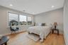 Bedroom with wood finished floors and recessed lighting