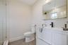 Full bathroom featuring vanity, tile patterned floors, and tiled shower