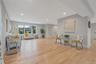 Living area featuring light wood-style flooring and recessed lighting
