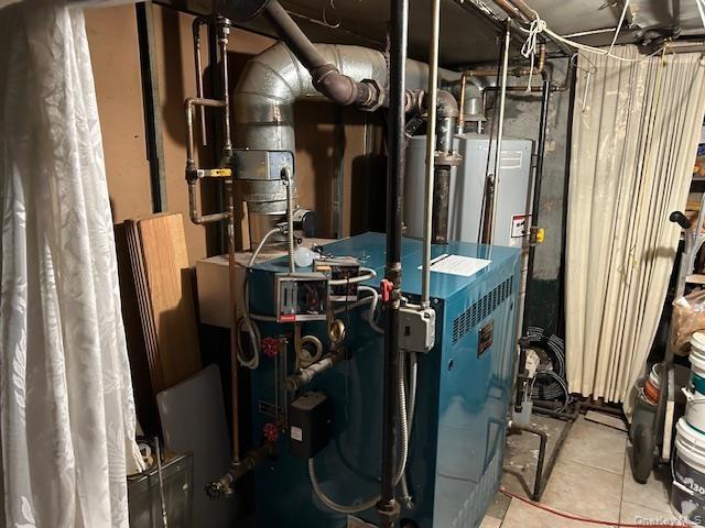 Utility room featuring a heating unit