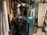 Utility room featuring a heating unit
